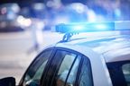 Man charged after business robbed while employee working late