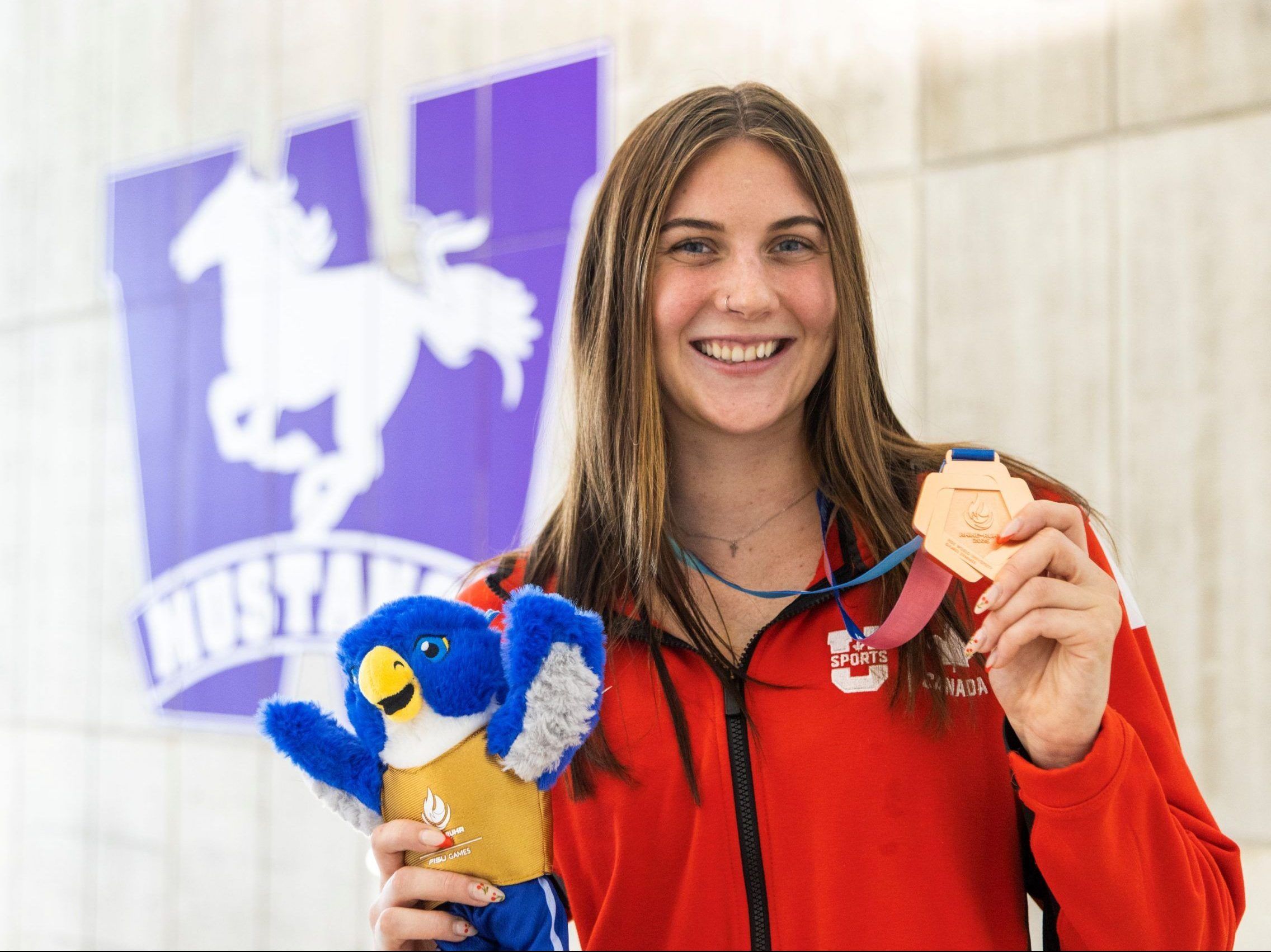 Western Mustangs swimmer wins international bronze amid stunning rise