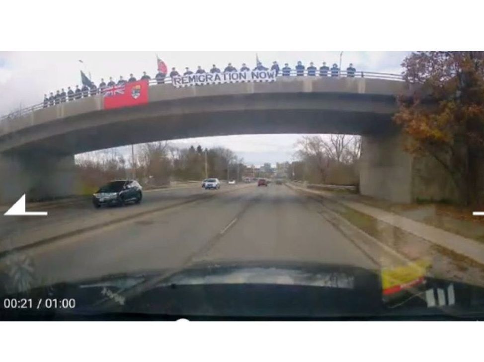 Masked ‘nationalist club’ members take protest to London overpass