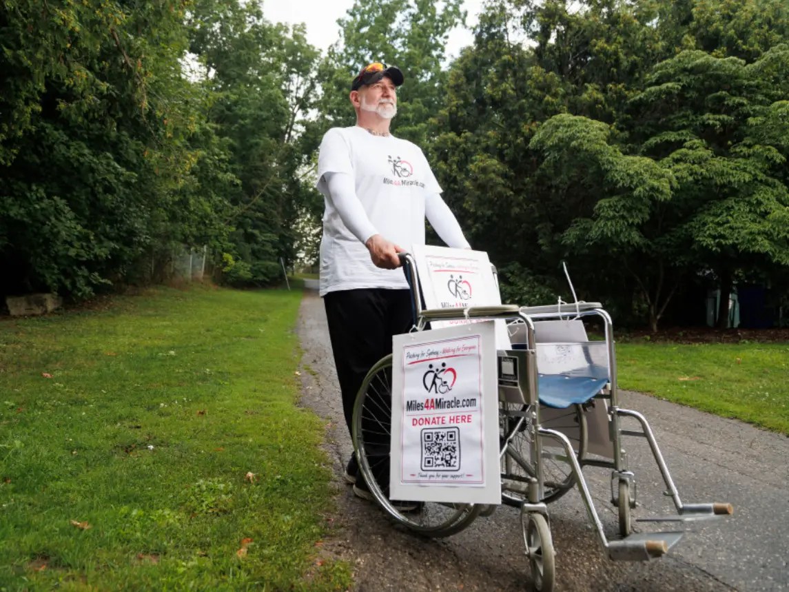 London dad pushing daughter’s wheelchair 200 km in fight for $493K surgery