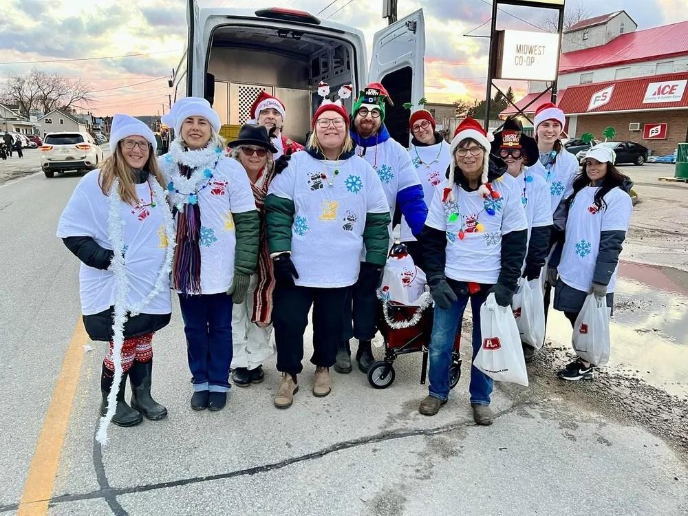 United Way collecting sock donations at Santa Claus Parade, Nov. 30